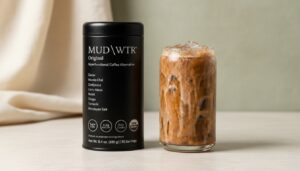 MUD/WTR Original beside an iced cacao and chai drink.